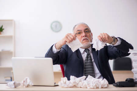 Old male employee in brainstorming conceptの写真素材