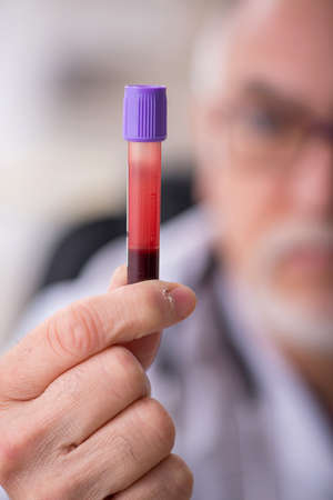 Old male doctor chemist in  virus conceptの写真素材
