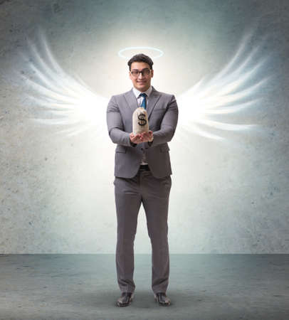 Angel investor concept with businessman with wingsの写真素材