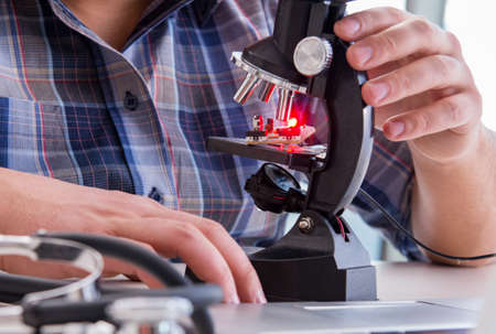 High precision engineering with man working with microscope