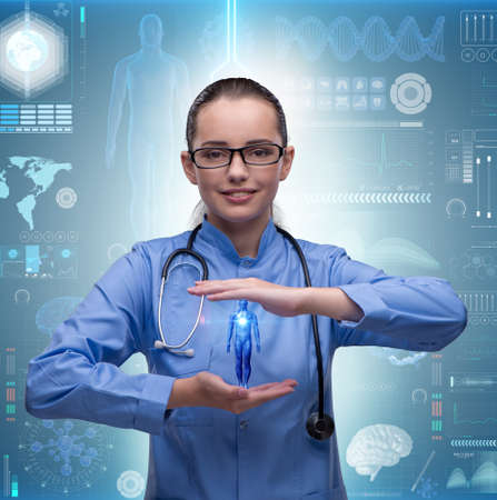 Woman doctor in futuristic medical conceptの写真素材
