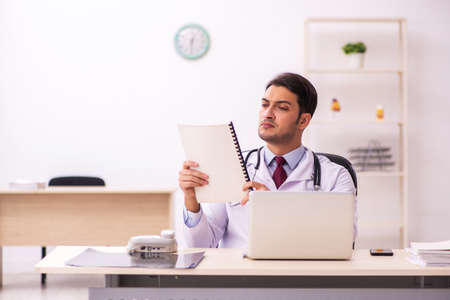 Young male doctor working in the clinicの写真素材