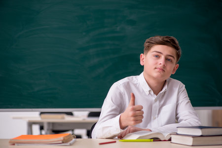 Boy sitting in the classromの写真素材