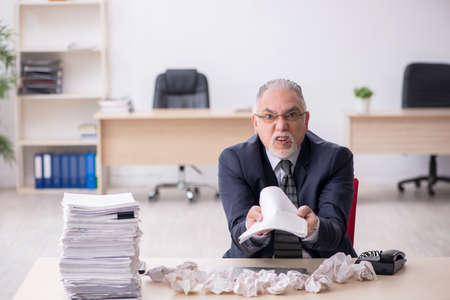 Old male employee in brainstorming conceptの写真素材