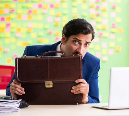 Businessman with many conflicting prioritiesの写真素材