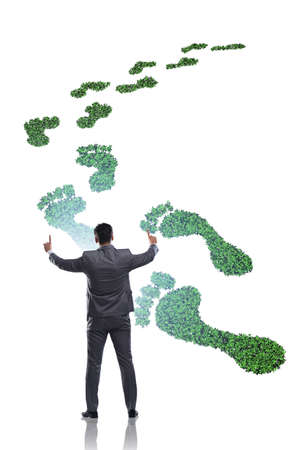 Ecology concept with green footprint and businessmanの写真素材