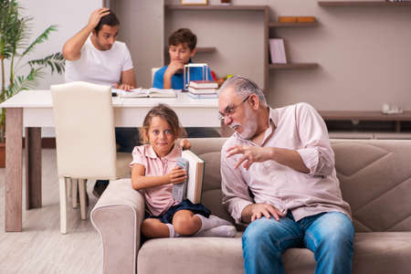 Three generations at home during pandemicの写真素材