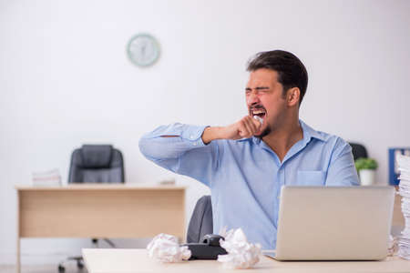 Young male employee rejecting new ideas in the officeの写真素材