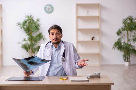 Young male doctor radiologist working in the clinicの写真素材