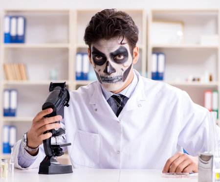 Scary monster doctor working in labの写真素材