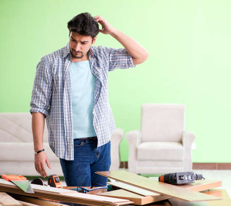 Woodworker working in his workshopの写真素材