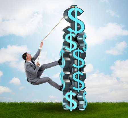 Businessman climbing dollar challenge tower
