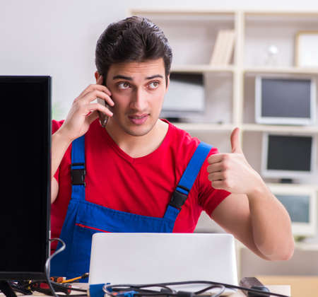 Professional repair engineer repairing broken tv