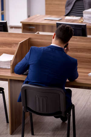 Young businessman employee working in the officeの写真素材