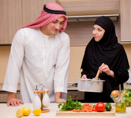 Young arab family in the kitchenの写真素材