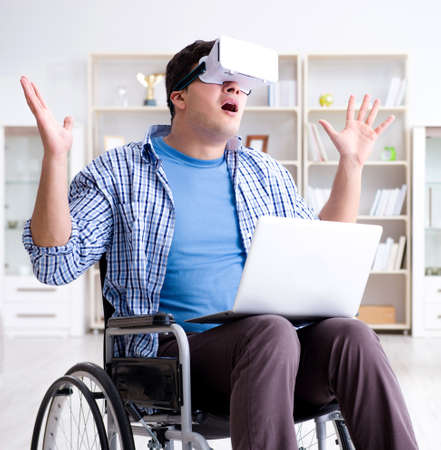 Freelance student studying with laptop and virtual reality glassの写真素材