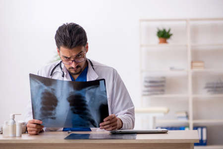 Young male doctor radiologist working in the clinicの写真素材