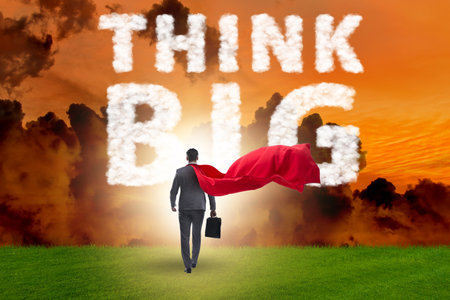 Think big concept with businessman superheroの写真素材