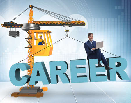 Businessman in career progression concept with craneの写真素材
