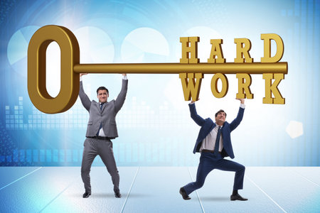 Concept of hard work with key and businessmanの写真素材