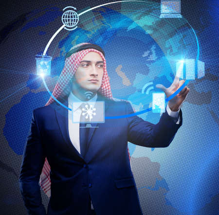 Arab man in global computing conceptの写真素材