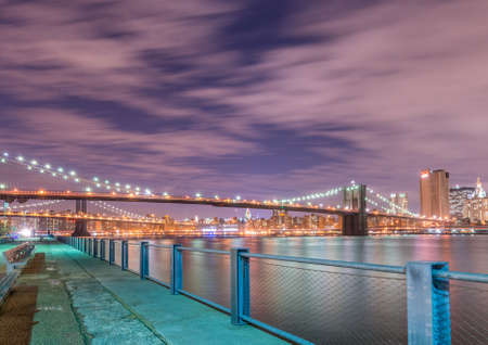 Night view of Manhattan and Brooklyn bridgeの写真素材