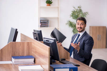 Young male employee working in the officeの写真素材