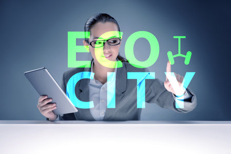Ecocity ecology concept with businesswomanの写真素材
