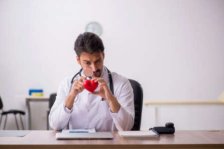 Young male doctor cardiologist working in the clinicの写真素材