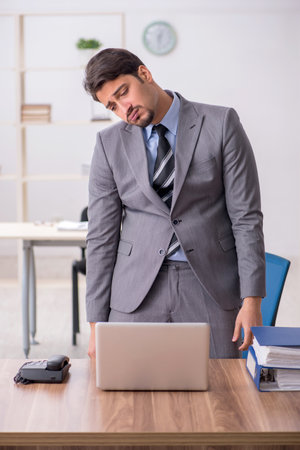Young male employee working in the officeの写真素材