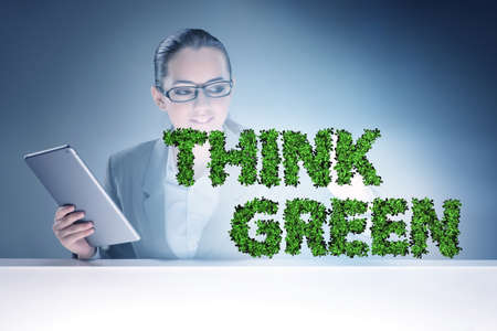 Think green ecological concept with businesswomanの写真素材