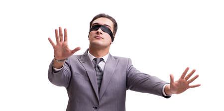Blindfolded businessman isolated on whiteの写真素材
