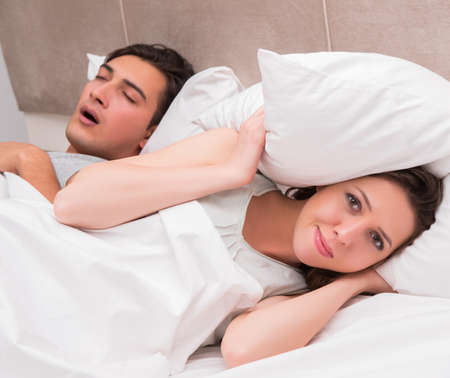 Woman having trouble with husband snoring