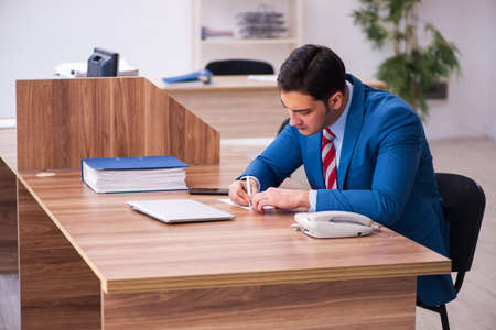 Young businessman employee working in the officeの写真素材