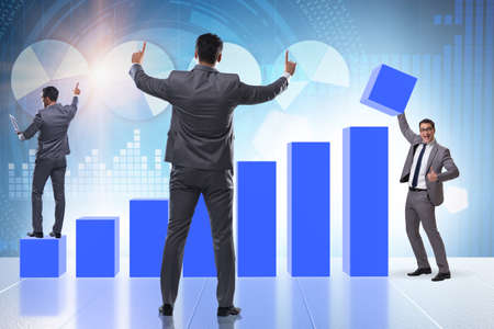 Businessman supporting economic growth on chartの写真素材
