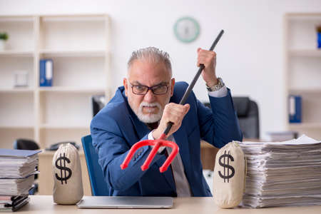 Old male employee unhappy with excessive work in the office