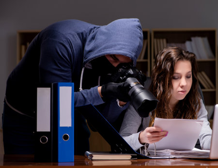 Hacker stealing personal data from home computerの写真素材