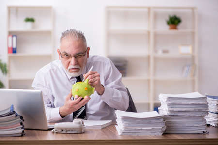 Old male employee in retirement conceptの写真素材