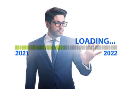 Businessman pressing virtual button with year 2022の写真素材