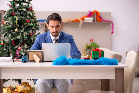Young businessman working from home at Christmas eveの写真素材