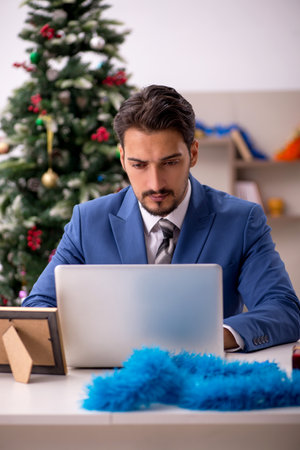Young businessman working from home at Christmas eveの写真素材
