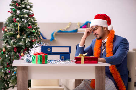 Young businessman working from home at Christmas eveの写真素材