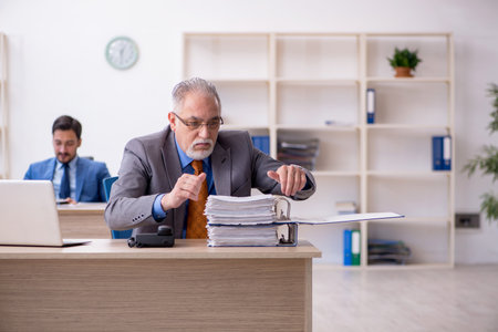 Two colleagues working in the officeの写真素材