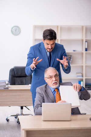 Two colleagues working in the officeの写真素材