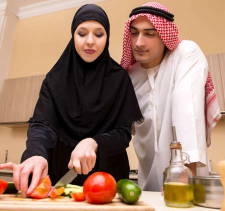 Young arab family in the kitchenの写真素材