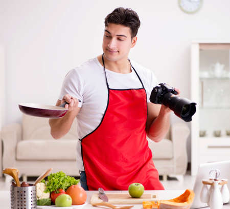 Food blogger working in the kitchenの写真素材