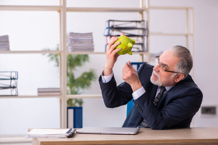 Old male employee in retirement conceptの写真素材