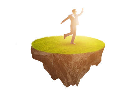 Businessman on floating island in business conceptの写真素材