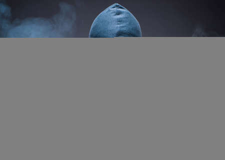 Computer hacker working in dark roomの写真素材