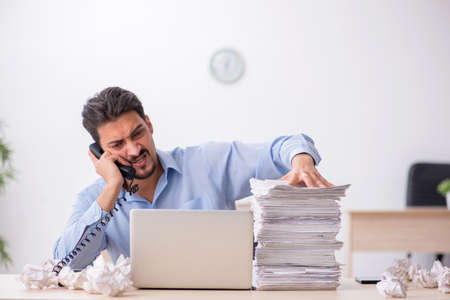 Young male employee rejecting new ideas in the office